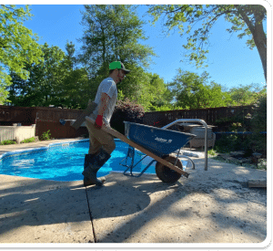 Textured, light-colored concrete pool deck with a visible control joint in Richmond VA