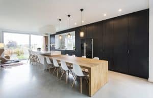 Light gray polished concrete floor in a modern kitchen and dining area in Richmond VA