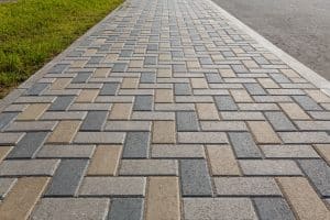 Paver block walkway with herringbone pattern, light gray, dark gray, and tan blocks in Richmond VA