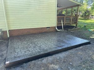 Stamped concrete patio with ashlar slate pattern in front of a house in Hopewell VA