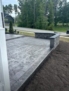 Stamped concrete patio, dark gray, with square tile pattern and darker border in Chesterfield VA
